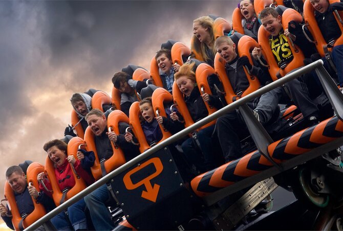 People riding Oblivion roller coaster