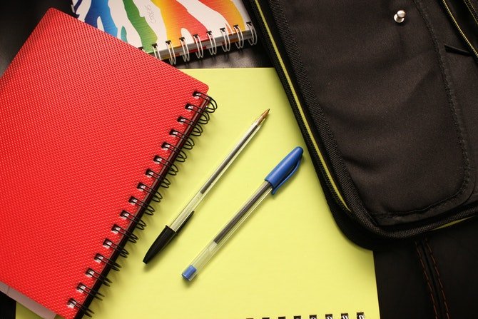 School bag, notebook and pens