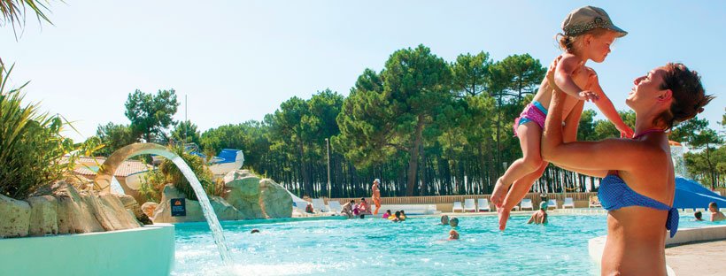 Woman and child by open air pool