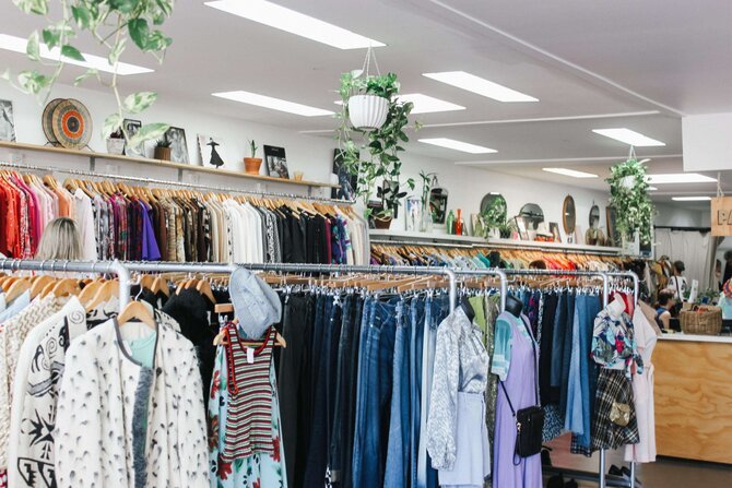 Clothes on rail in charity shop