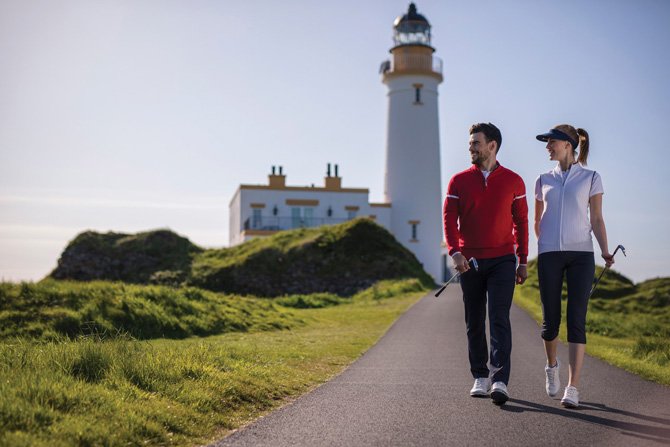 Man and woman playing golf