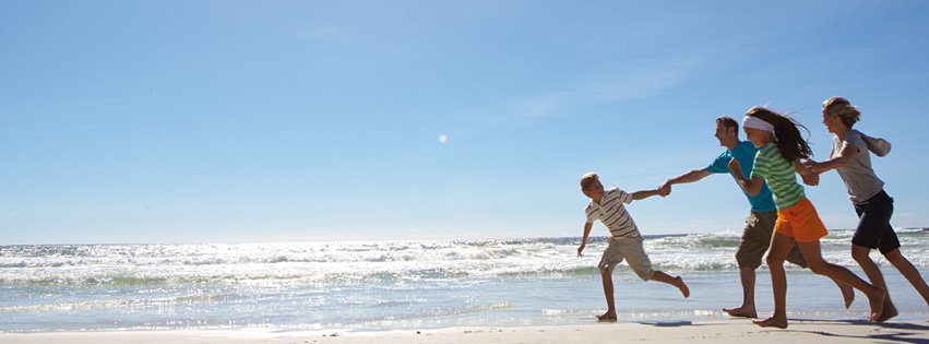 family on the beach at a Haven holiday park