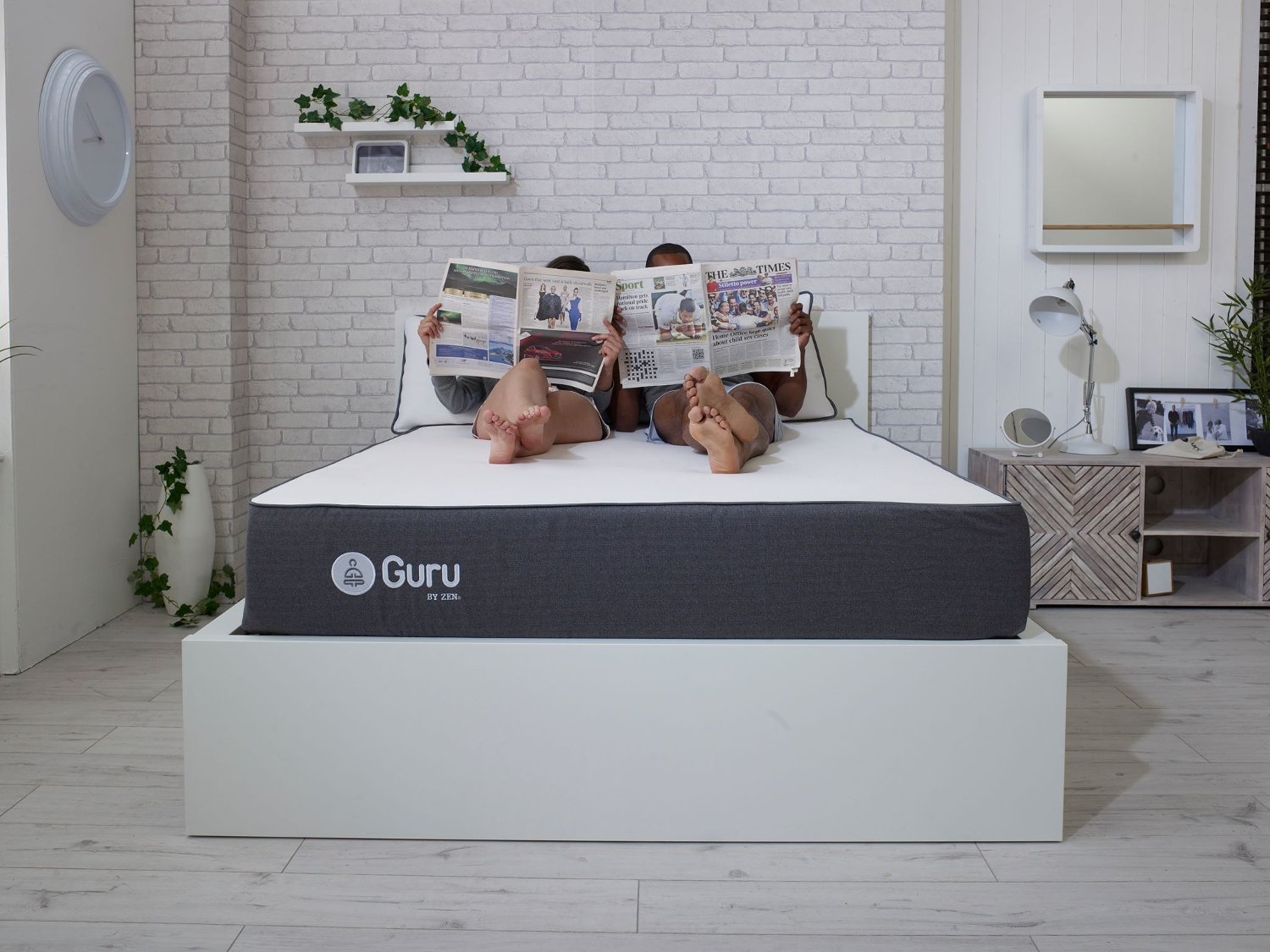 Two people reading in bed