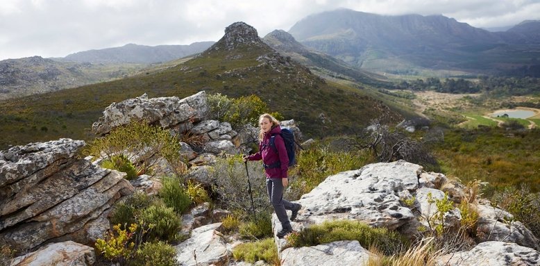 Woman wearing Mountain Warehouse hiking boots and clothing