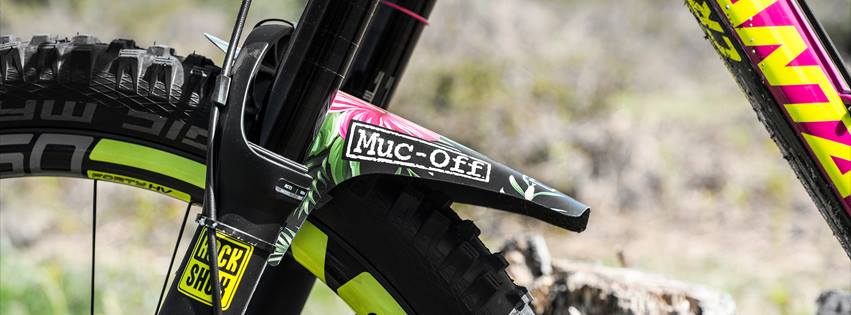 Muc Off discount code banner - dirt bike with Muc Off sticker on