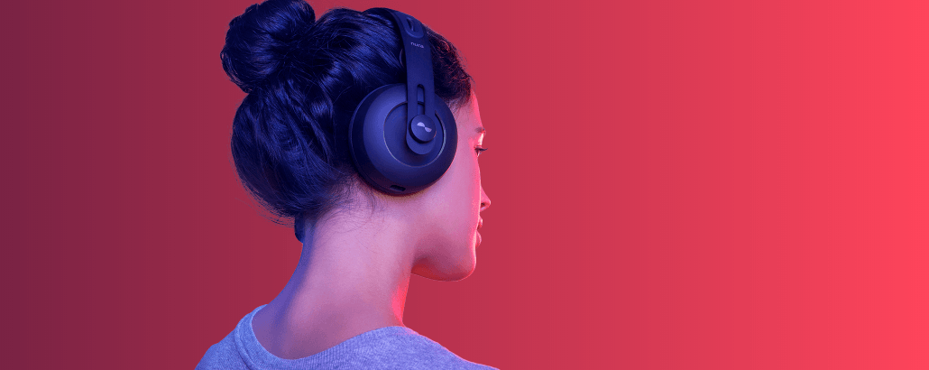 Girl wearing Nuraphone headphones to listen to music