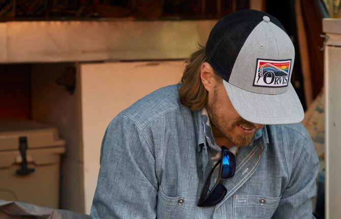 Man wearing Orvis hat