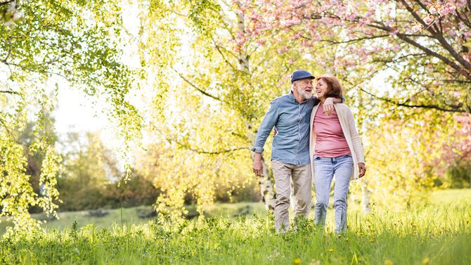 Man and woman walking in the forest