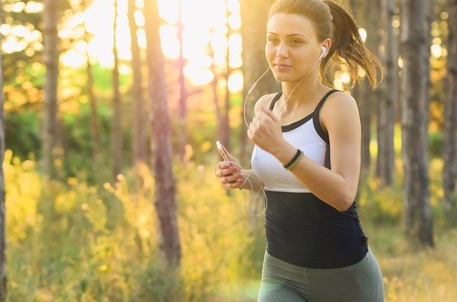 Girl running in forest