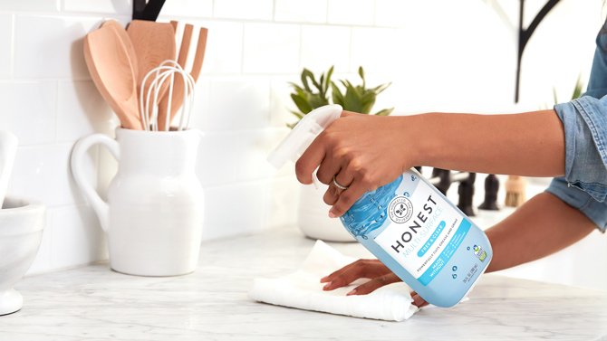 Woman cleaning in kitchen