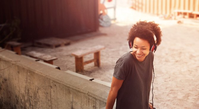 Woman listening to music with Sennheiser headphones