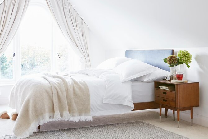 Double bed with white bedsheets