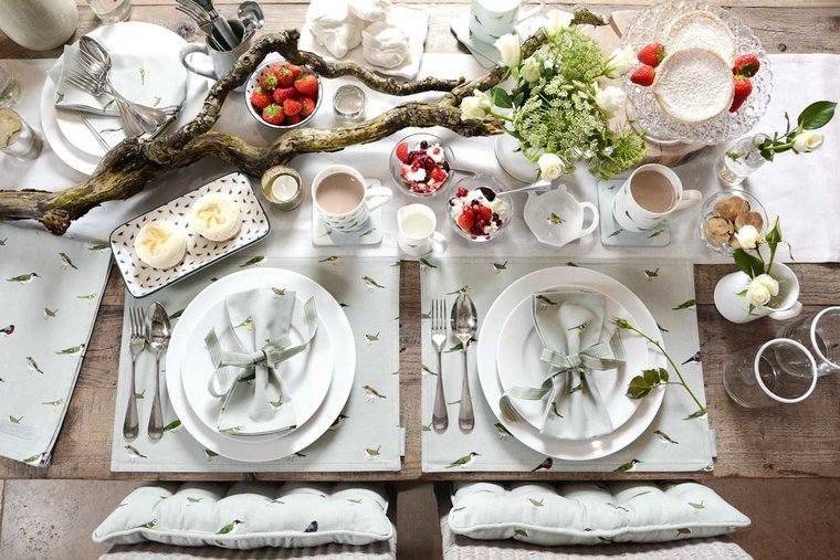 Sophie Allport Banner Image - outdoor garden table set up, with plates, crockery, cutlery and more