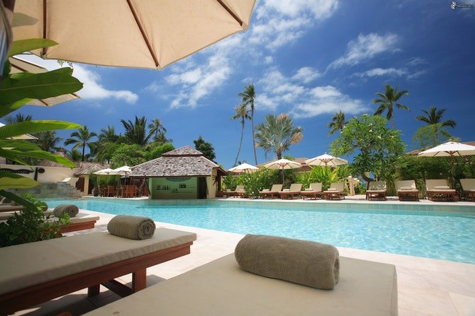 Swimming pool with sun lounger