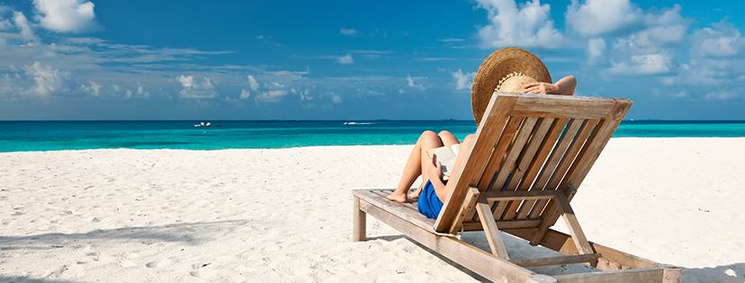 woman on a sunlounger on the beach