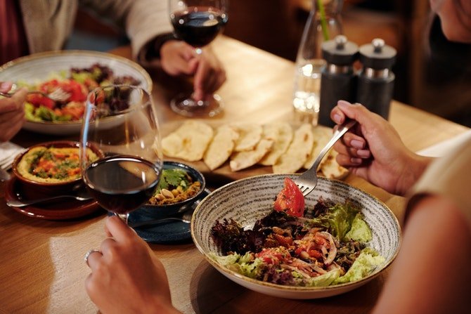 Two people eating dinner at a restaurant